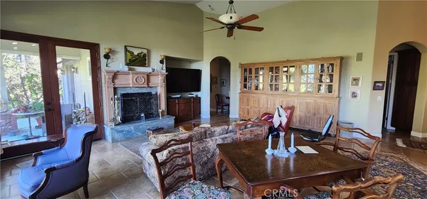 a living room with fireplace furniture and a flat screen tv