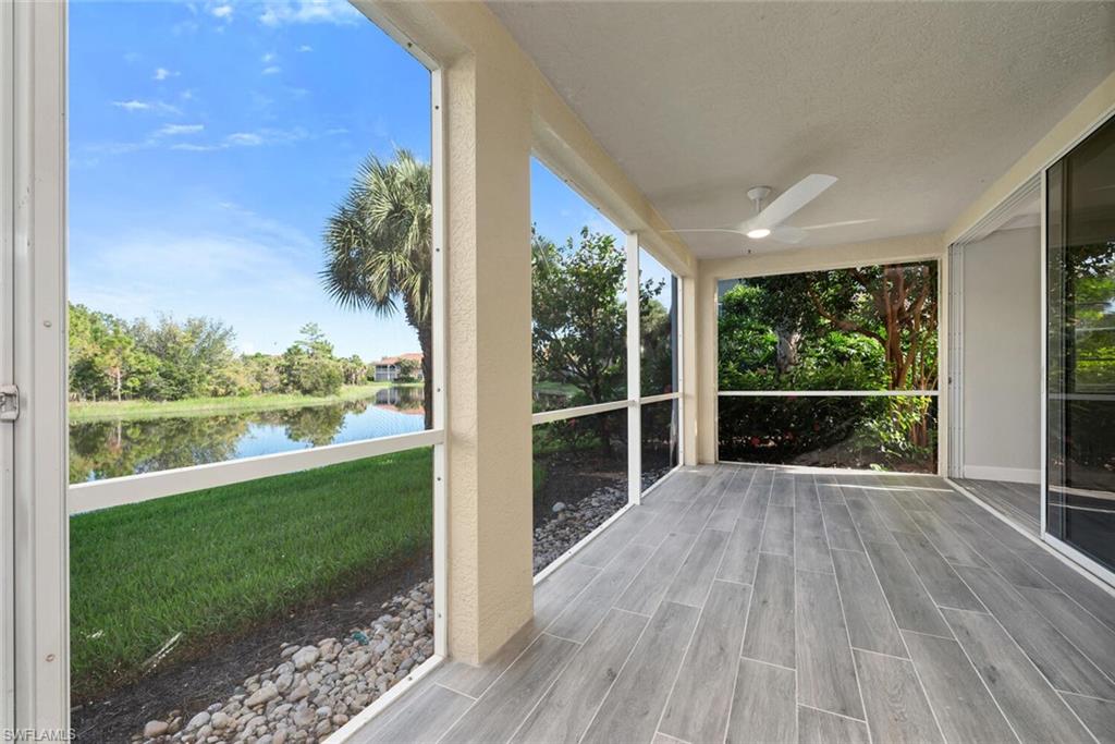 10771 Crooked River Road, Unit 103 Estero, FL 34135 - Photo 16 of 21 a view of balcony with wooden floor and fence