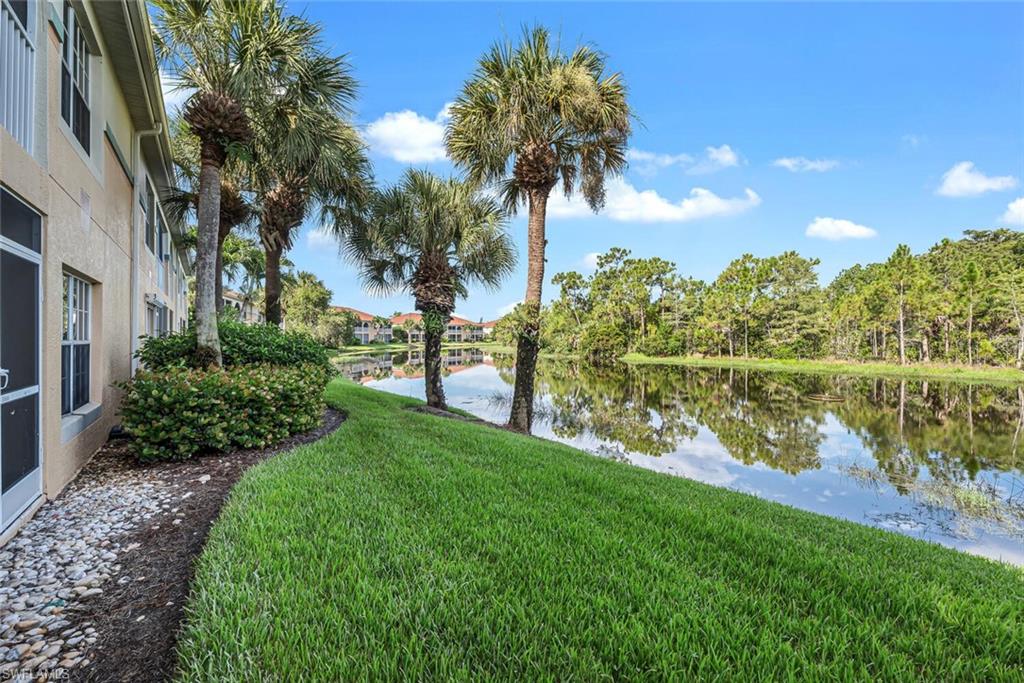 10771 Crooked River Road, Unit 103 Estero, FL 34135 - Photo 18 of 21 a view of a garden with a lake