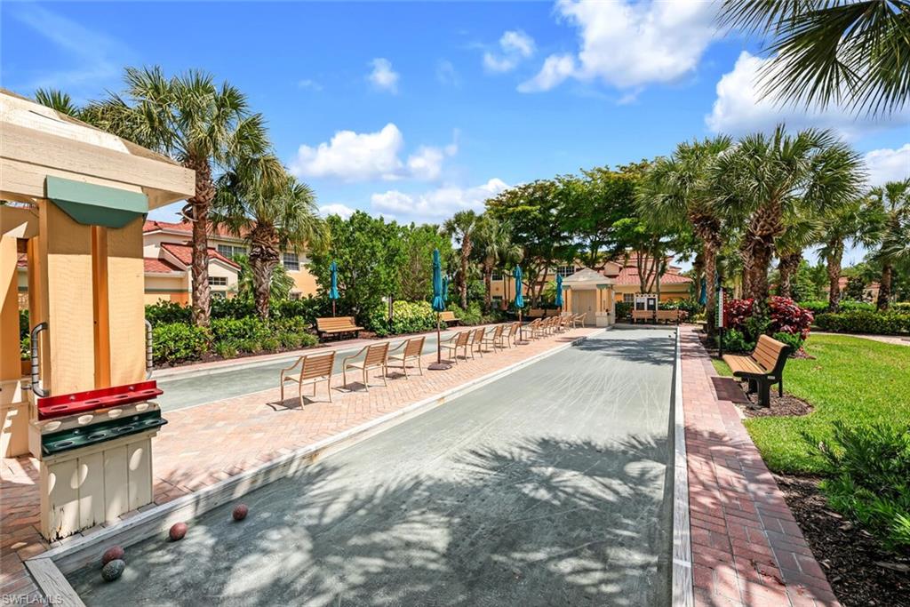 10771 Crooked River Road, Unit 103 Estero, FL 34135 - Photo 20 of 21 a view of a park with swings and slides