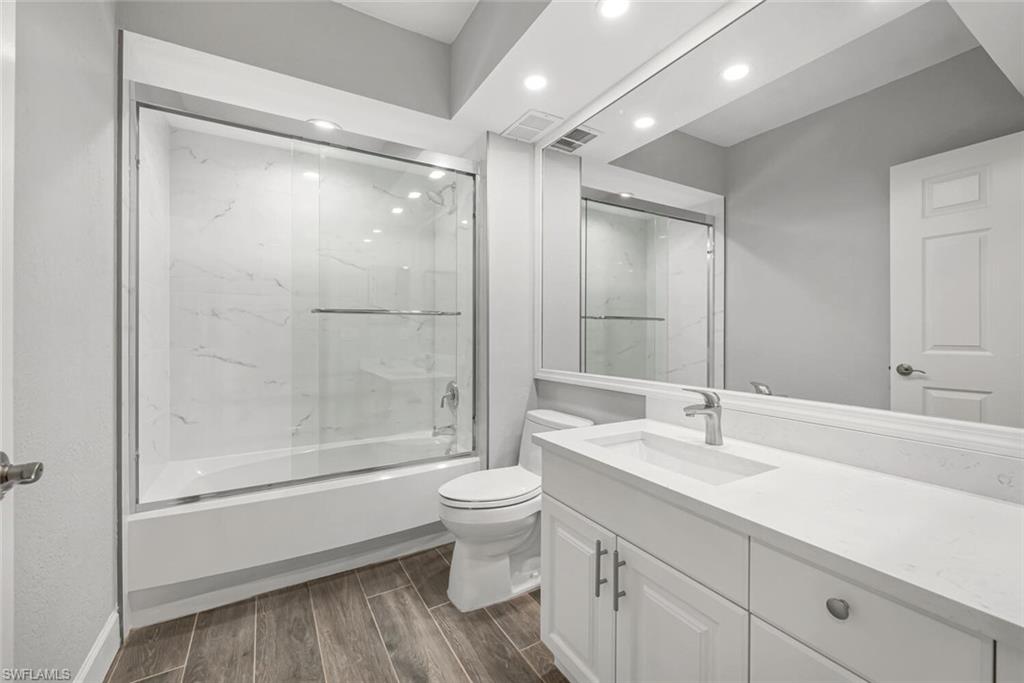 10771 Crooked River Road, Unit 103 Estero, FL 34135 - Photo 9 of 21 a bathroom with a sink a toilet and shower