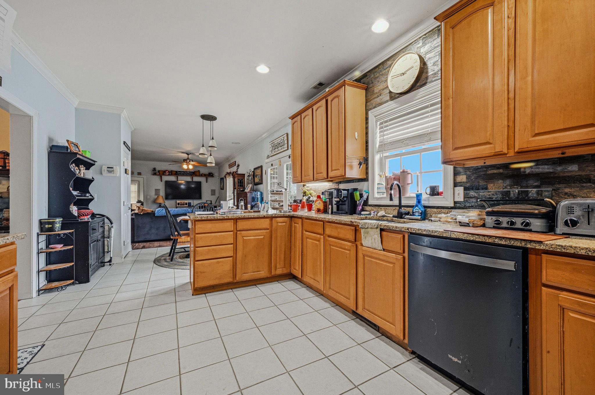 31536 Jestice Farm Road Laurel, DE 19956 - Photo 15 of 35 a kitchen with stainless steel appliances granite countertop a sink and cabinets