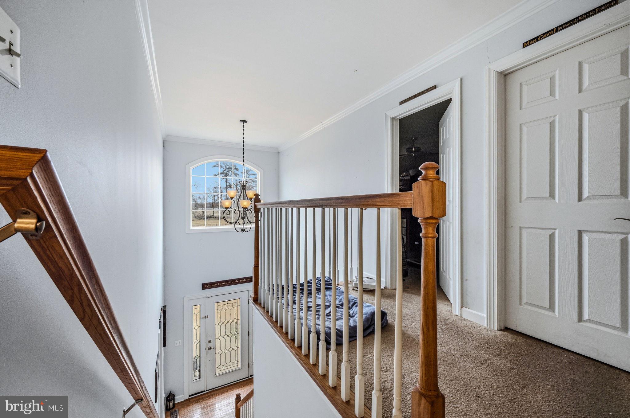 31536 Jestice Farm Road Laurel, DE 19956 - Photo 22 of 35 a view of a hallway with wooden floor and staircase