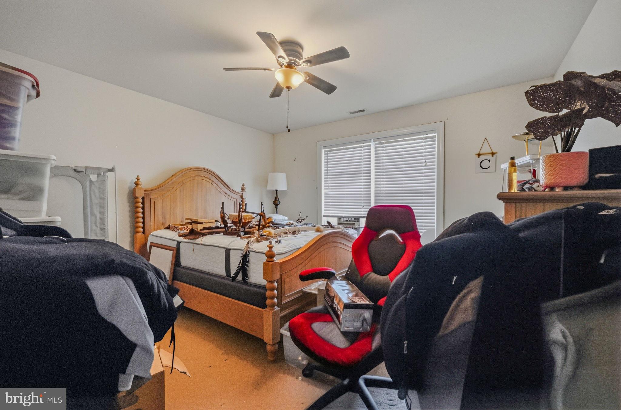 31536 Jestice Farm Road Laurel, DE 19956 - Photo 26 of 35 a bedroom with a bed and dresser