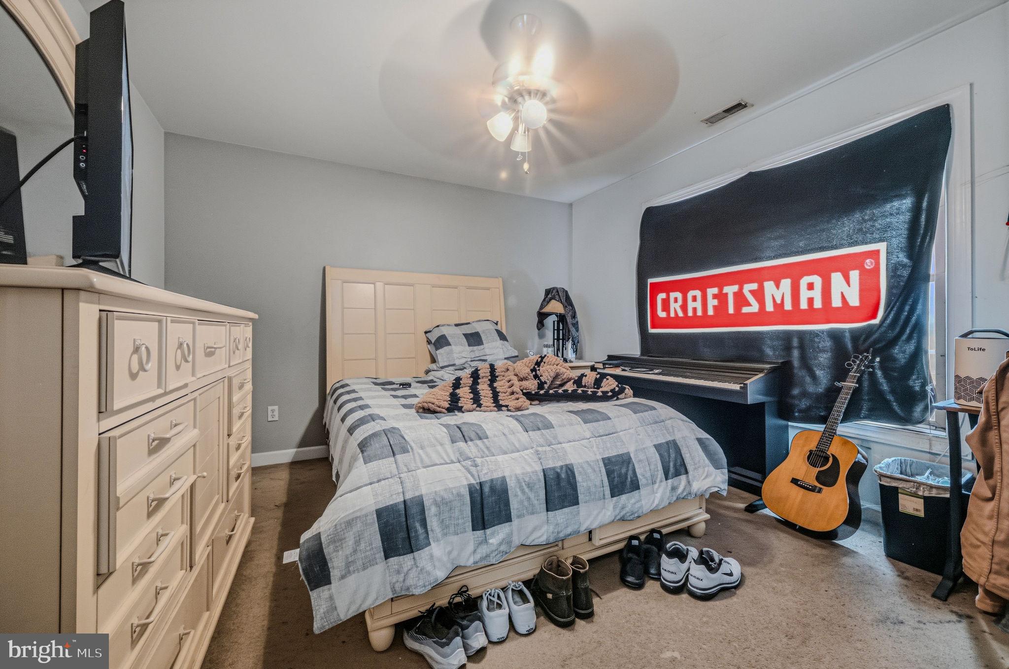 31536 Jestice Farm Road Laurel, DE 19956 - Photo 27 of 35 a bedroom with bed and a mirror