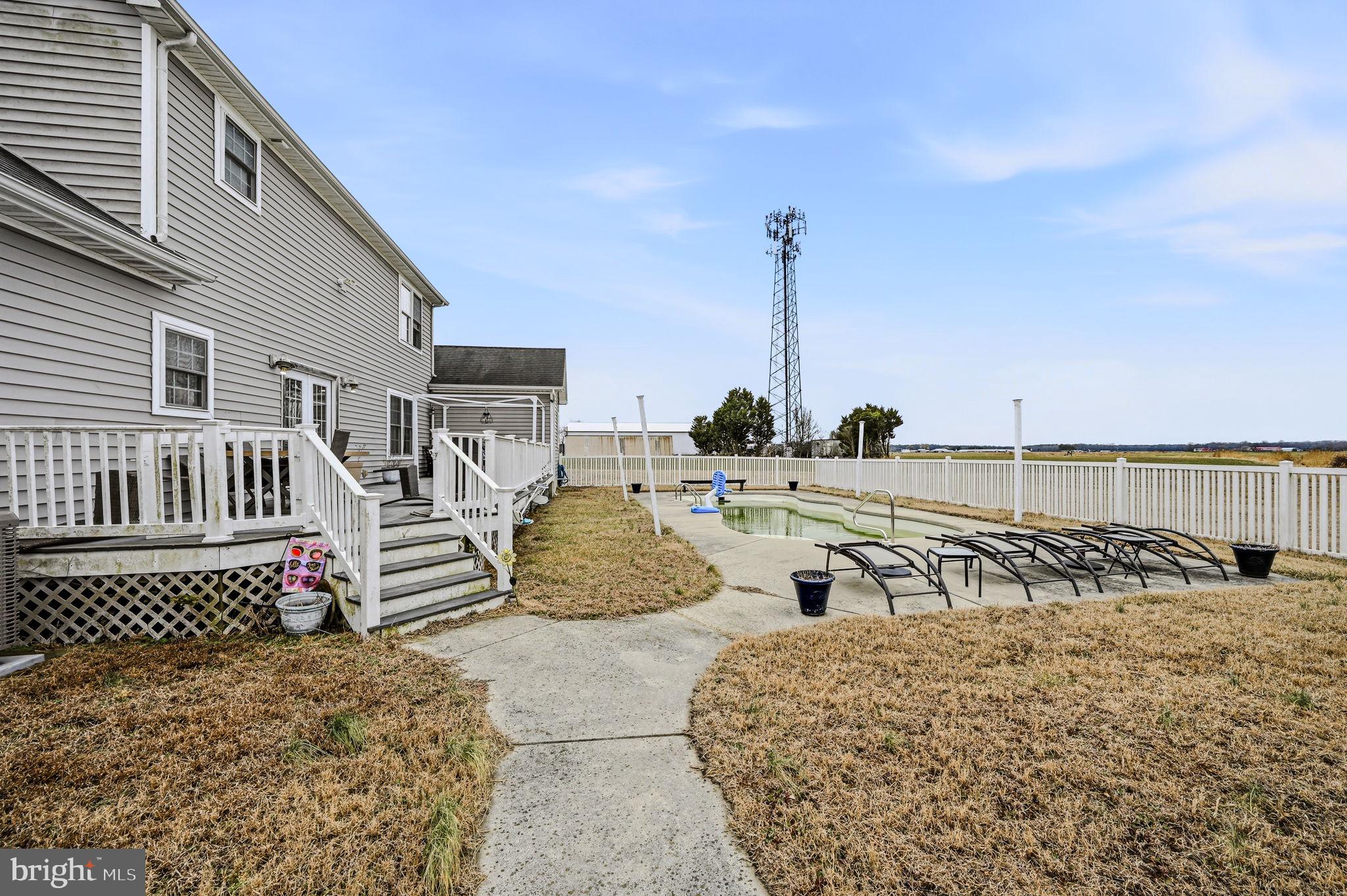 31536 Jestice Farm Road Laurel, DE 19956 - Photo 30 of 35 a view of roof deck with two chairs and wooden floor