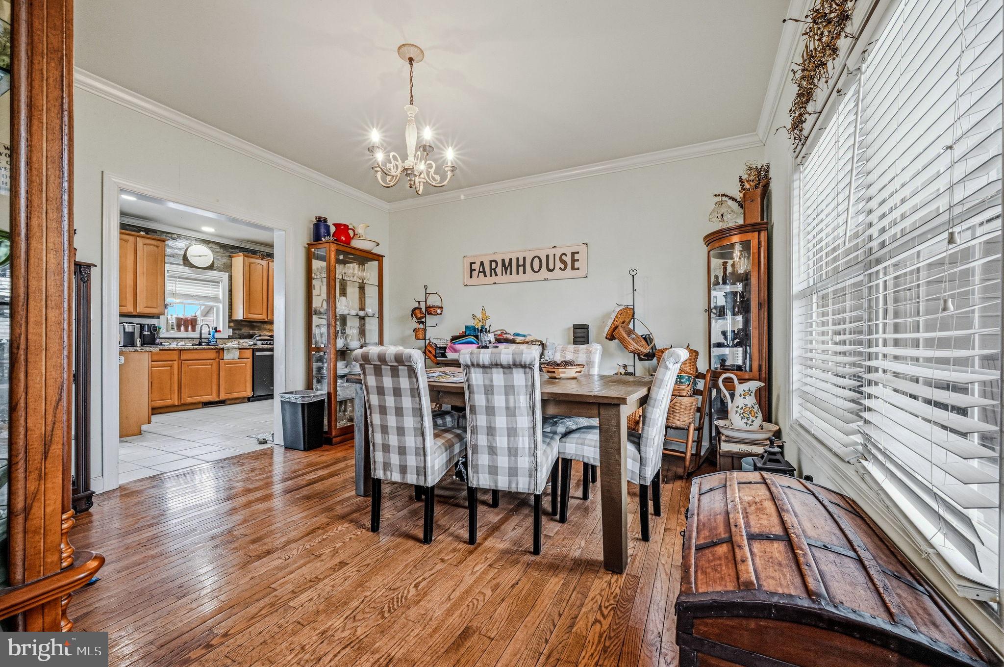 31536 Jestice Farm Road Laurel, DE 19956 - Photo 9 of 35 a view of a dining room with furniture wooden floor and chandelier