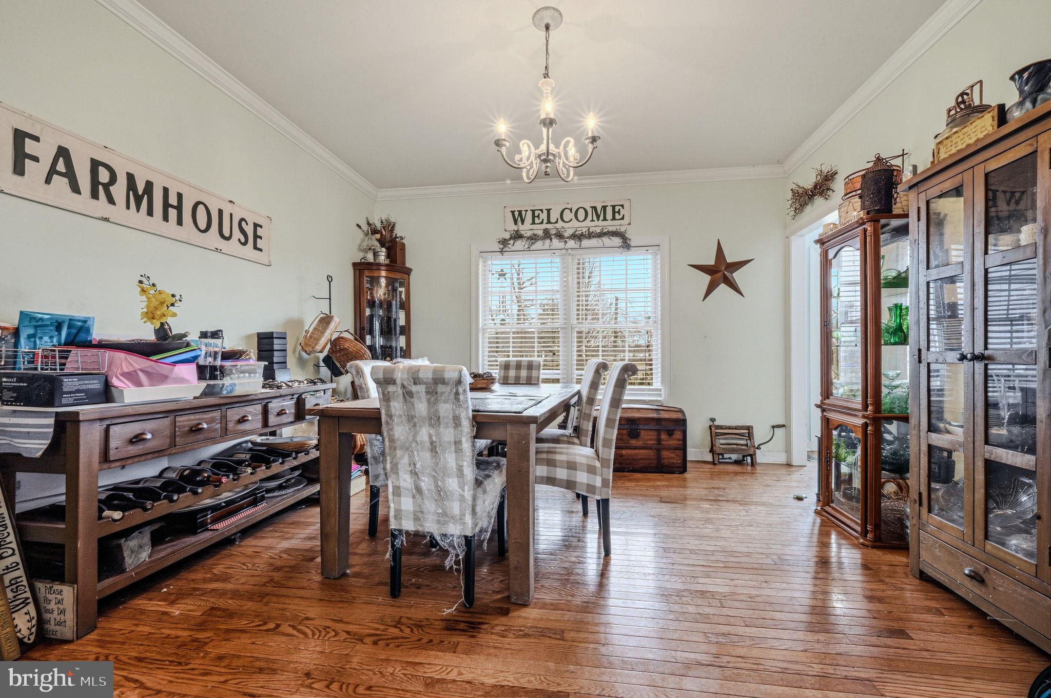 31536 Jestice Farm Road Laurel, DE 19956 - Photo 10 of 35 a view of a dining room with furniture window and wooden floor