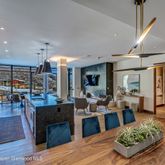 a living room with lots of furniture and a table