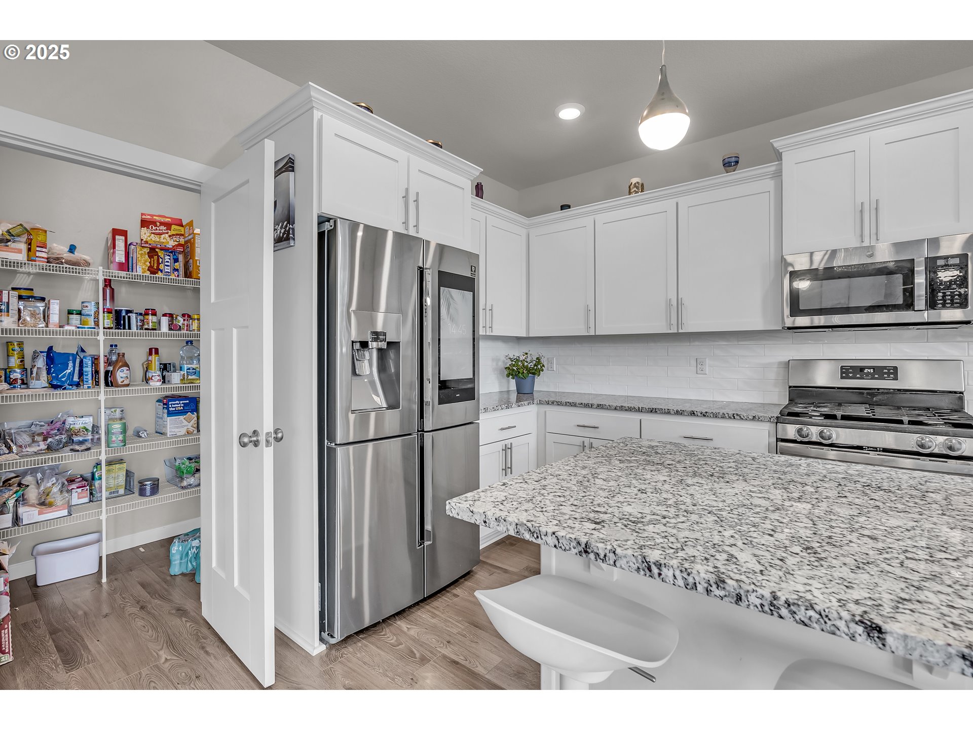 13305 Northeast 114th Way Brush Prairie, WA 98606 - Photo 16 of 40 a kitchen with stainless steel appliances granite countertop a refrigerator and a sink