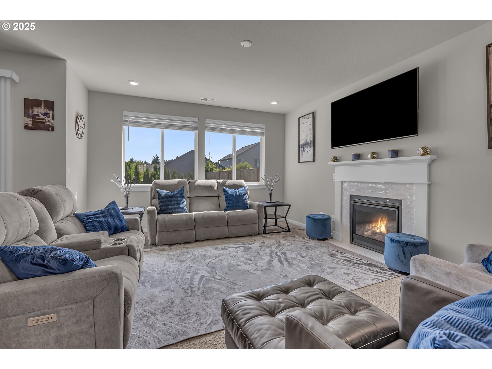 13305 Northeast 114th Way Brush Prairie, WA 98606 - Photo 18 of 40 a living room with furniture a flat screen tv and a fireplace