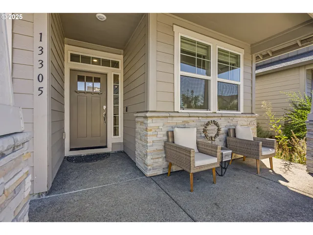 a backyard of a house with table and chairs