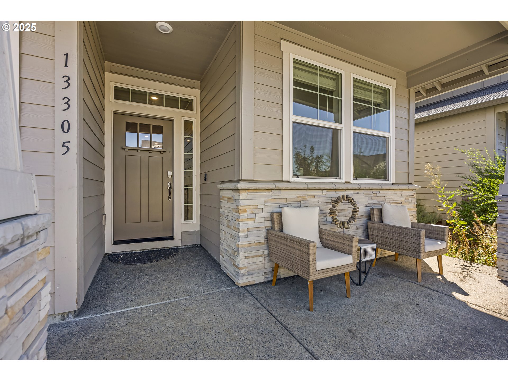 13305 Northeast 114th Way Brush Prairie, WA 98606 - Photo 2 of 40 a backyard of a house with table and chairs