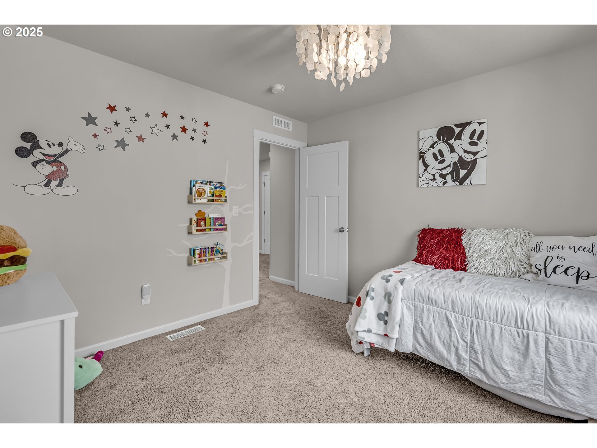 13305 Northeast 114th Way Brush Prairie, WA 98606 - Photo 28 of 40 a bedroom with a bed and a chandelier