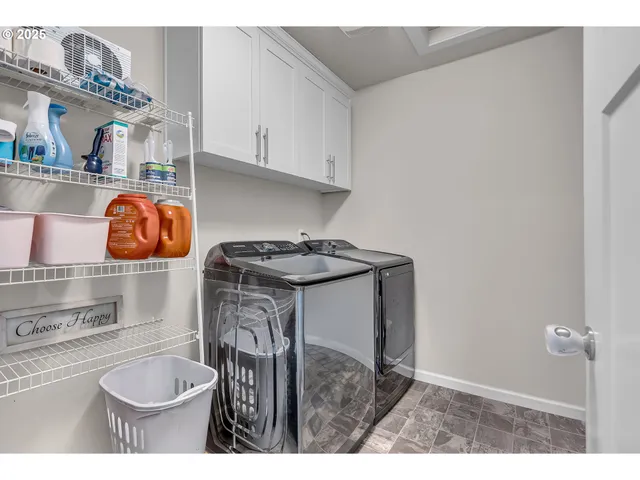 a kitchen with a sink a stove and cabinets