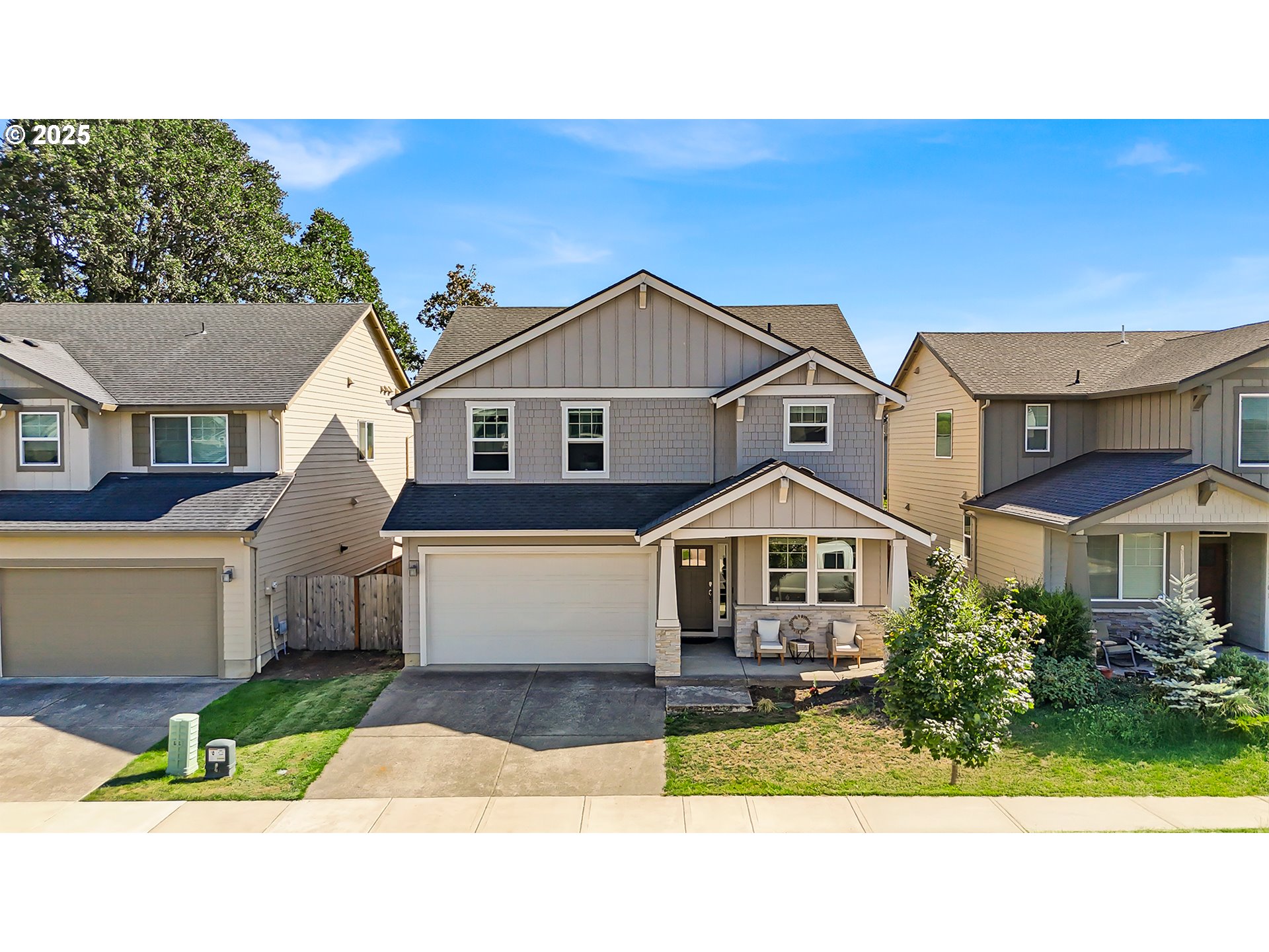 13305 Northeast 114th Way Brush Prairie, WA 98606 - Photo 38 of 40 a front view of a house with a yard and garage
