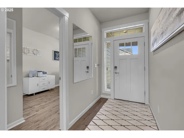 a view of bedroom with furniture and wooden floor