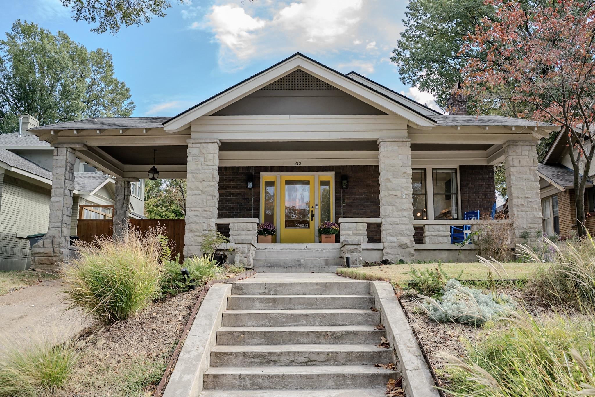 Craftsman-style home featuring brick siding and a porch