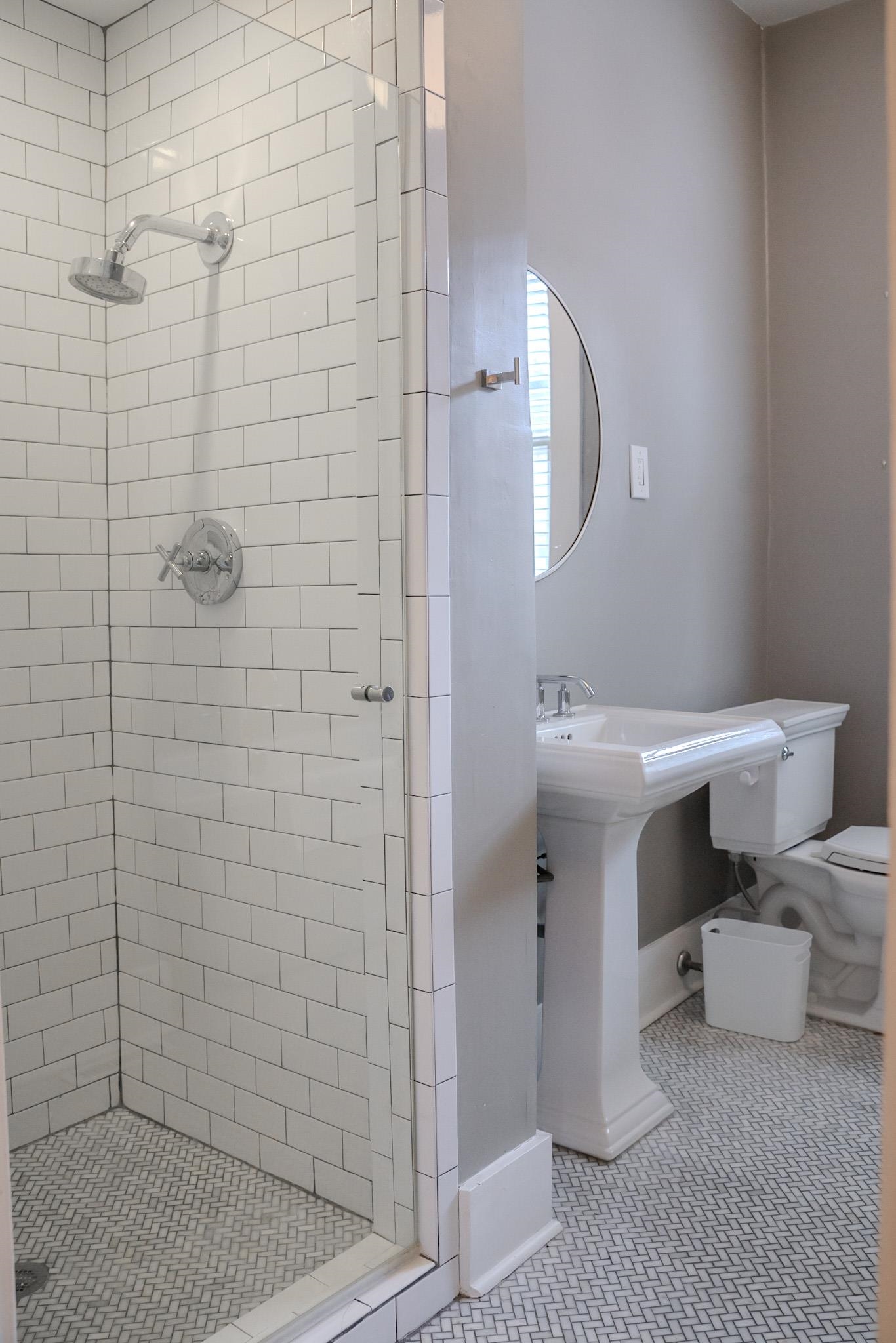 210 North Avalon Street Memphis, TN 38112 - Photo 17 of 30 Bathroom with toilet, tile patterned floors, baseboards, and a shower stall