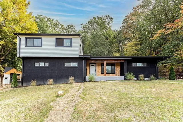 a front view of a house with a yard