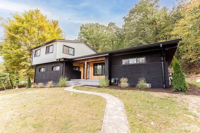 a front view of a house with a yard