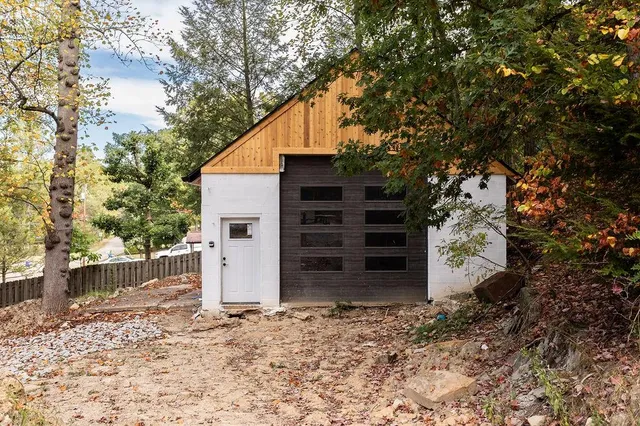 a view of a house with a backyard