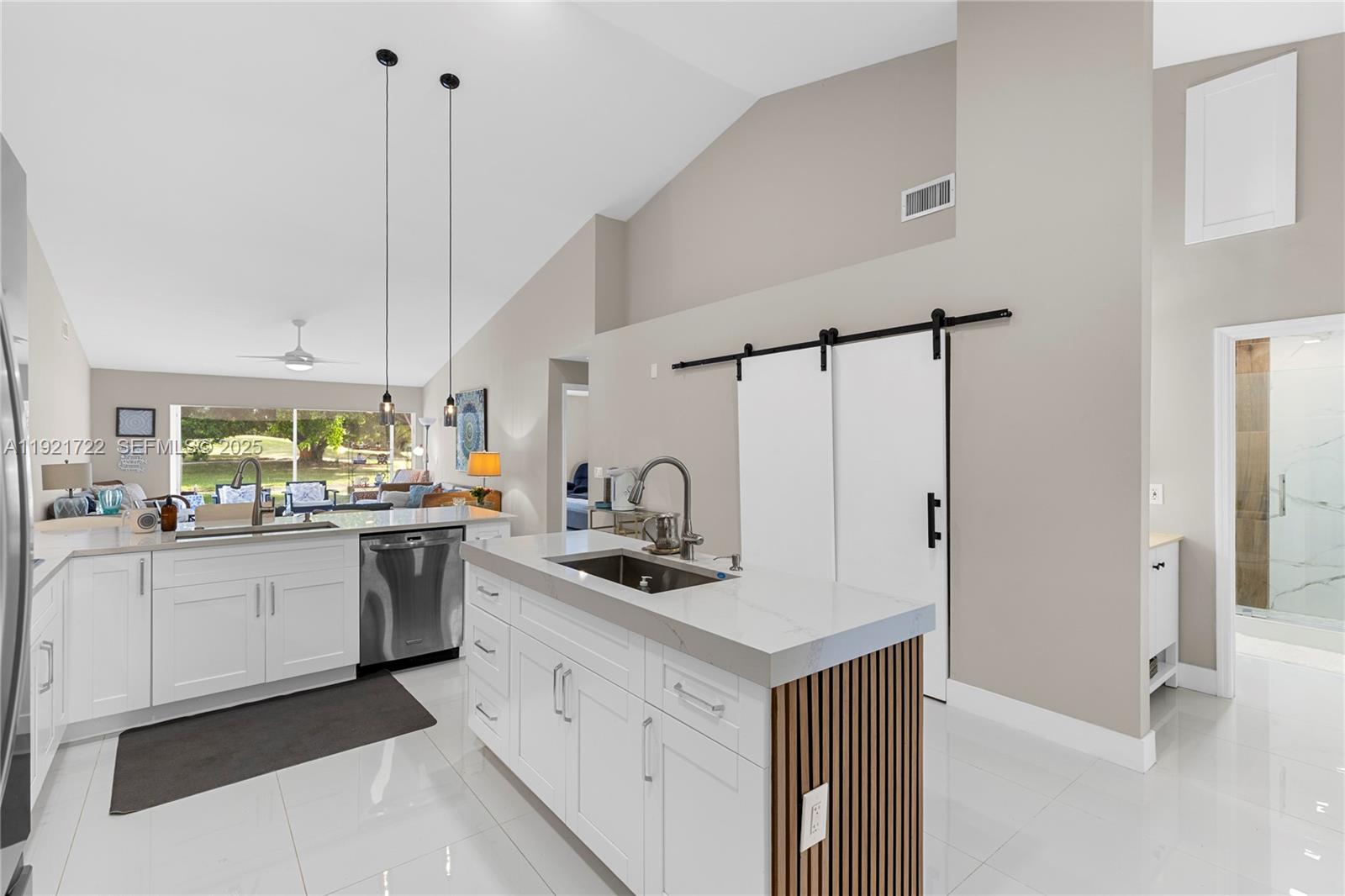 19648 Back 9 Drive, Unit 19648 Boca Raton, FL 33498 - Photo 13 of 39 a kitchen with stainless steel appliances granite countertop a sink stove and refrigerator