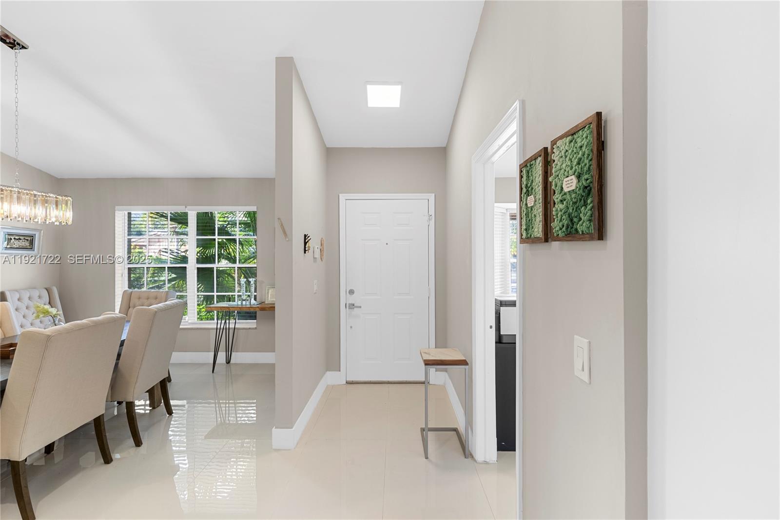 19648 Back 9 Drive, Unit 19648 Boca Raton, FL 33498 - Photo 21 of 39 a view of a livingroom with furniture and a window
