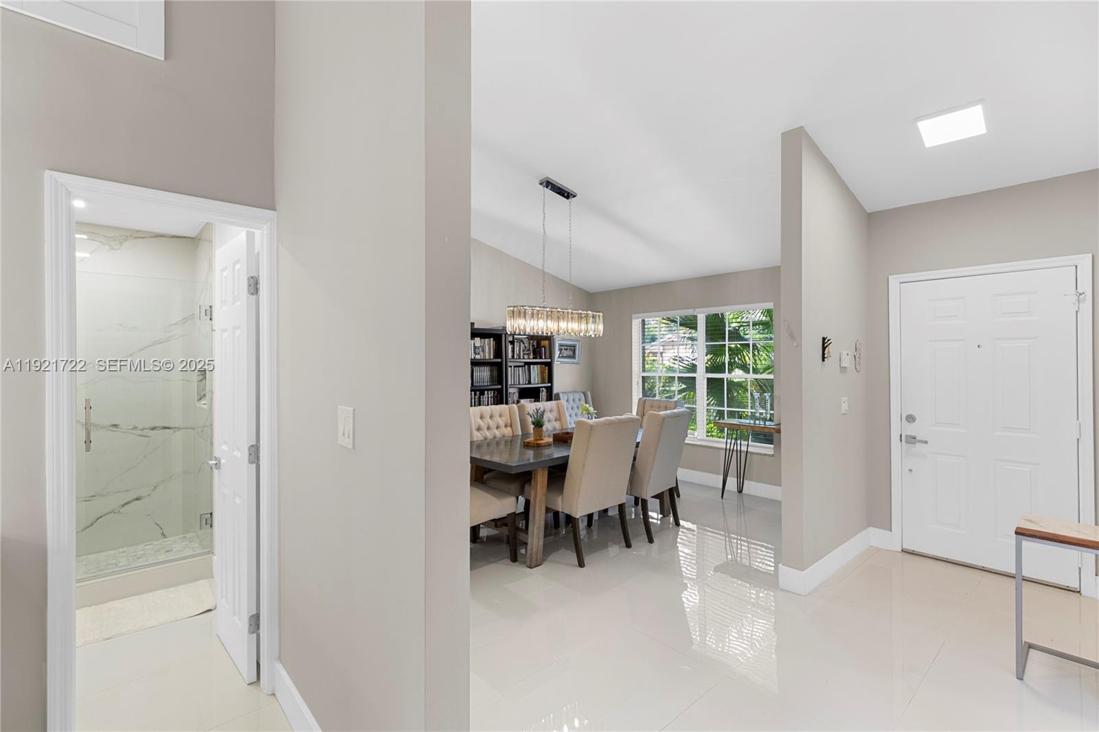 19648 Back 9 Drive, Unit 19648 Boca Raton, FL 33498 - Photo 22 of 39 a dining room with furniture and a window