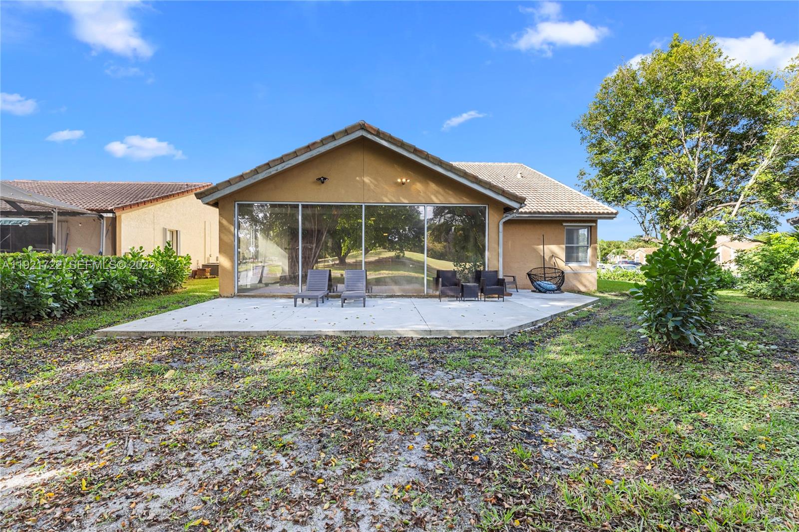 19648 Back 9 Drive, Unit 19648 Boca Raton, FL 33498 - Photo 26 of 39 a view of a house with a yard