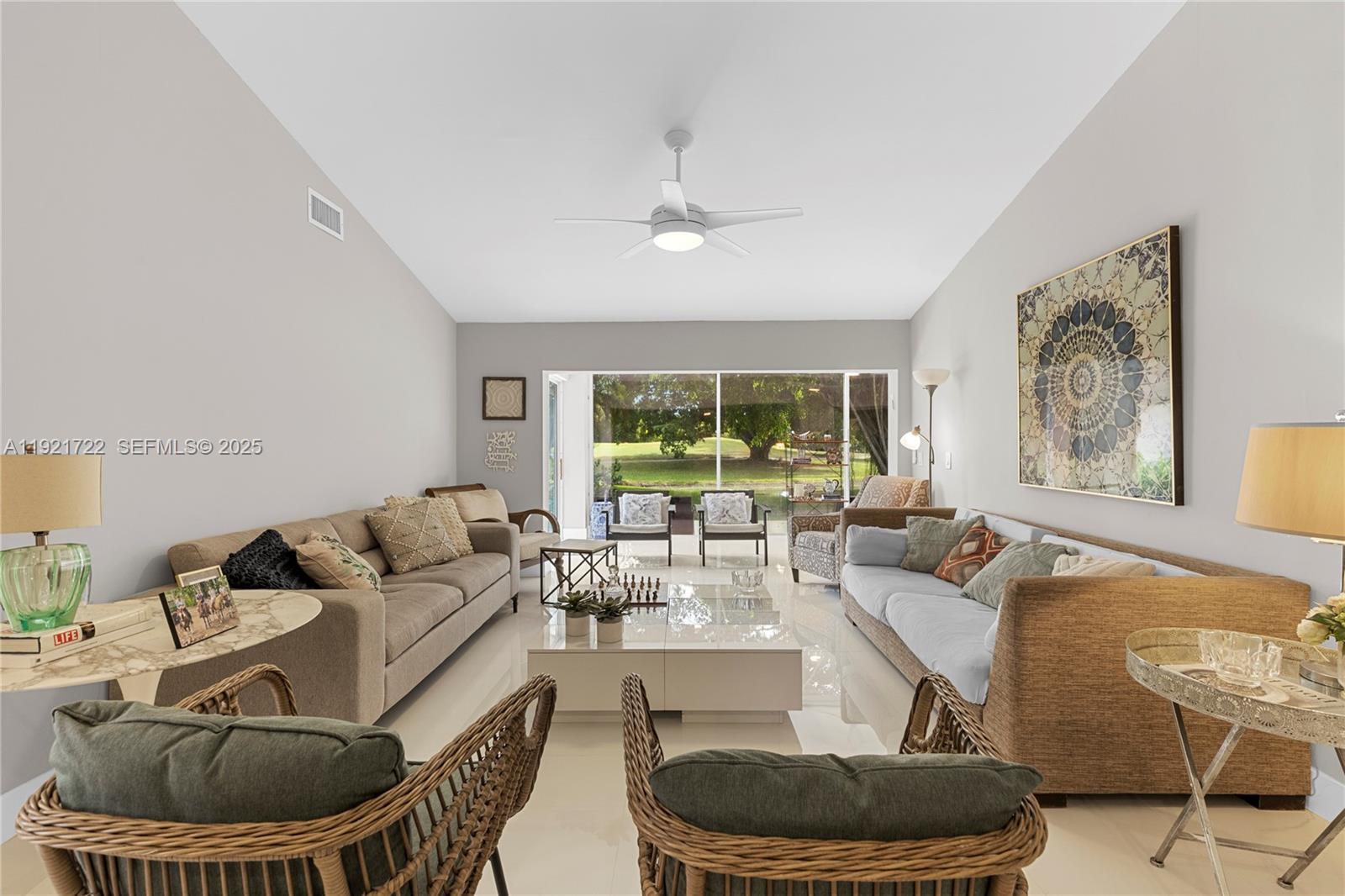 19648 Back 9 Drive, Unit 19648 Boca Raton, FL 33498 - Photo 7 of 39 a living room with furniture and a large window