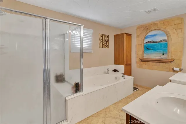 a bathroom with a bathtub and a shower