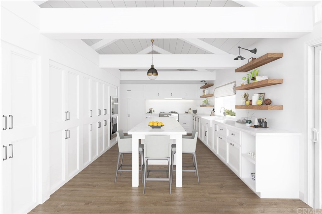 171 Monarch Bay Drive Dana Point, CA 92629 - Photo 7 of 12 a kitchen with stainless steel appliances a white table chairs and a refrigerator