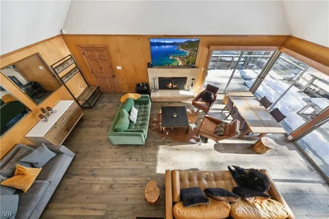 a view of living room with furniture and a fireplace