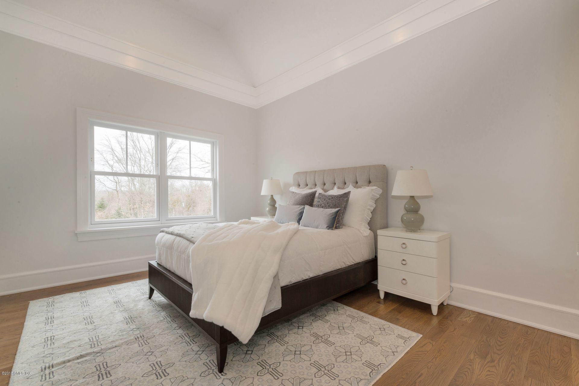 10 Lakeview Drive Riverside, CT 06878 - Photo 19 of 28 a bed room with a bed and a window