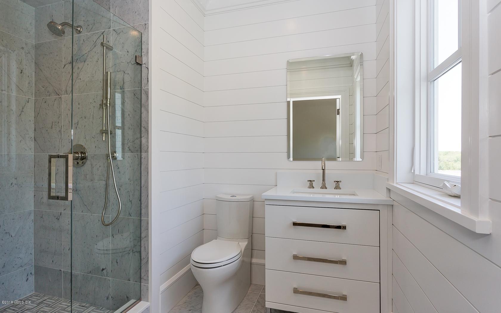 10 Lakeview Drive Riverside, CT 06878 - Photo 20 of 28 a bathroom with a sink a toilet and shower