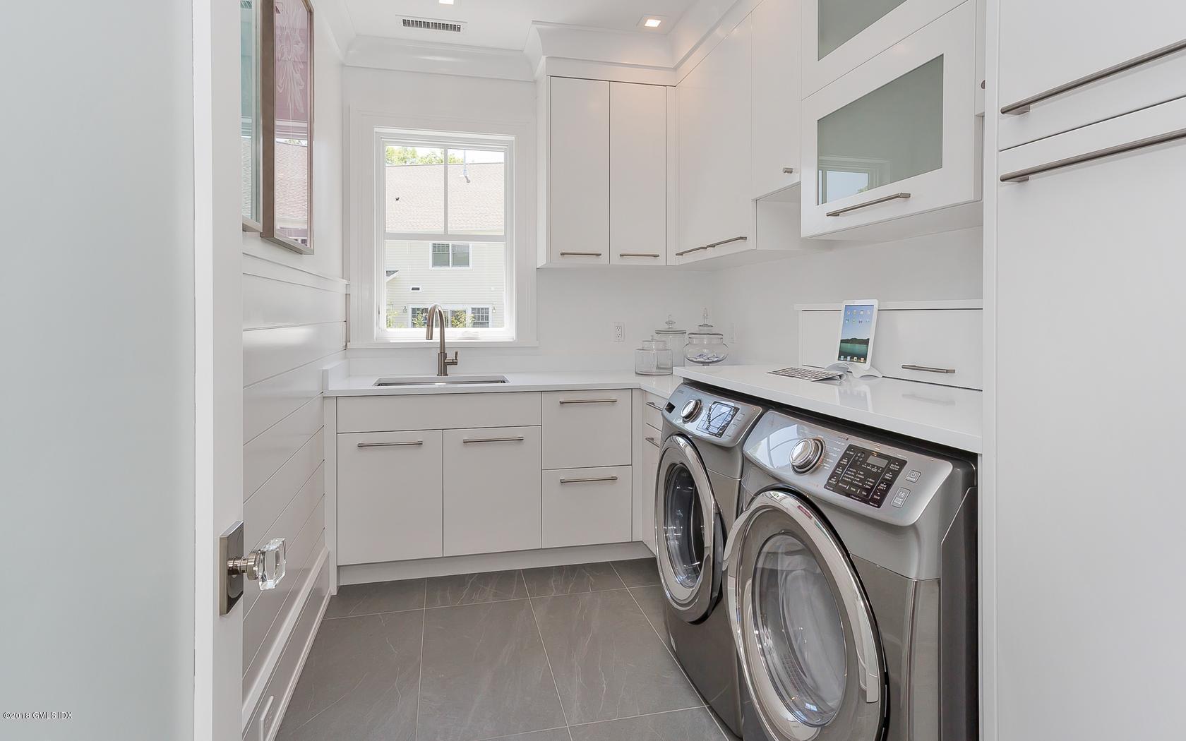 10 Lakeview Drive Riverside, CT 06878 - Photo 21 of 28 a utility room with sink dryer and washer