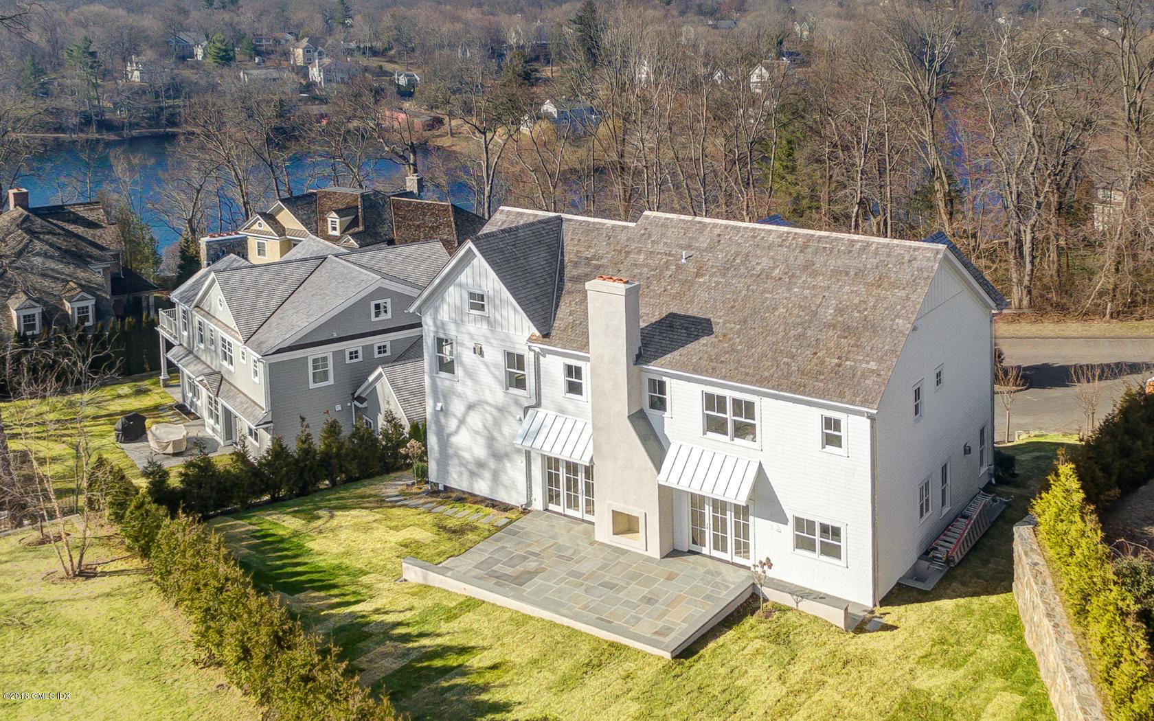10 Lakeview Drive Riverside, CT 06878 - Photo 3 of 28 a view of a white house with a yard