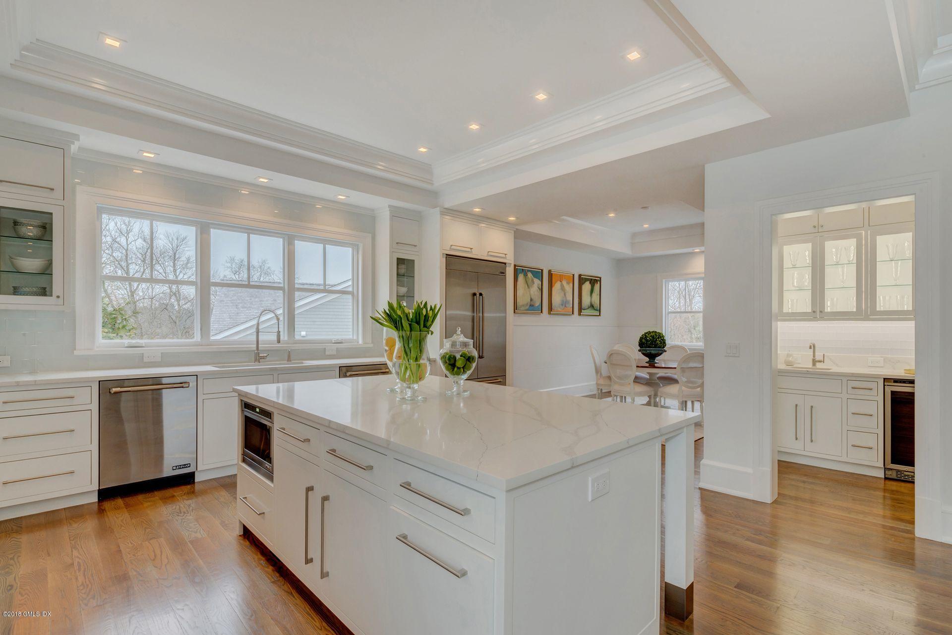 10 Lakeview Drive Riverside, CT 06878 - Photo 6 of 28 a kitchen with counter top space sink and center island