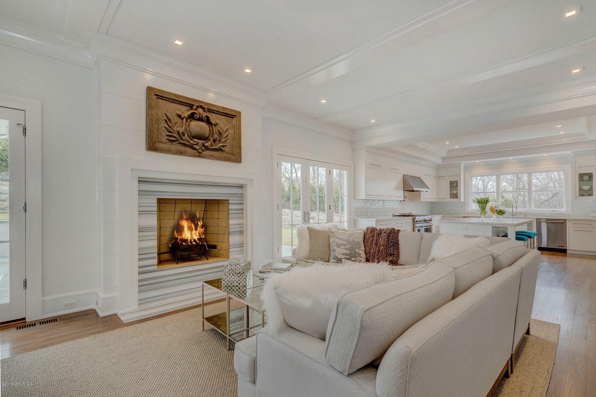 10 Lakeview Drive Riverside, CT 06878 - Photo 10 of 28 a living room with furniture and a fireplace