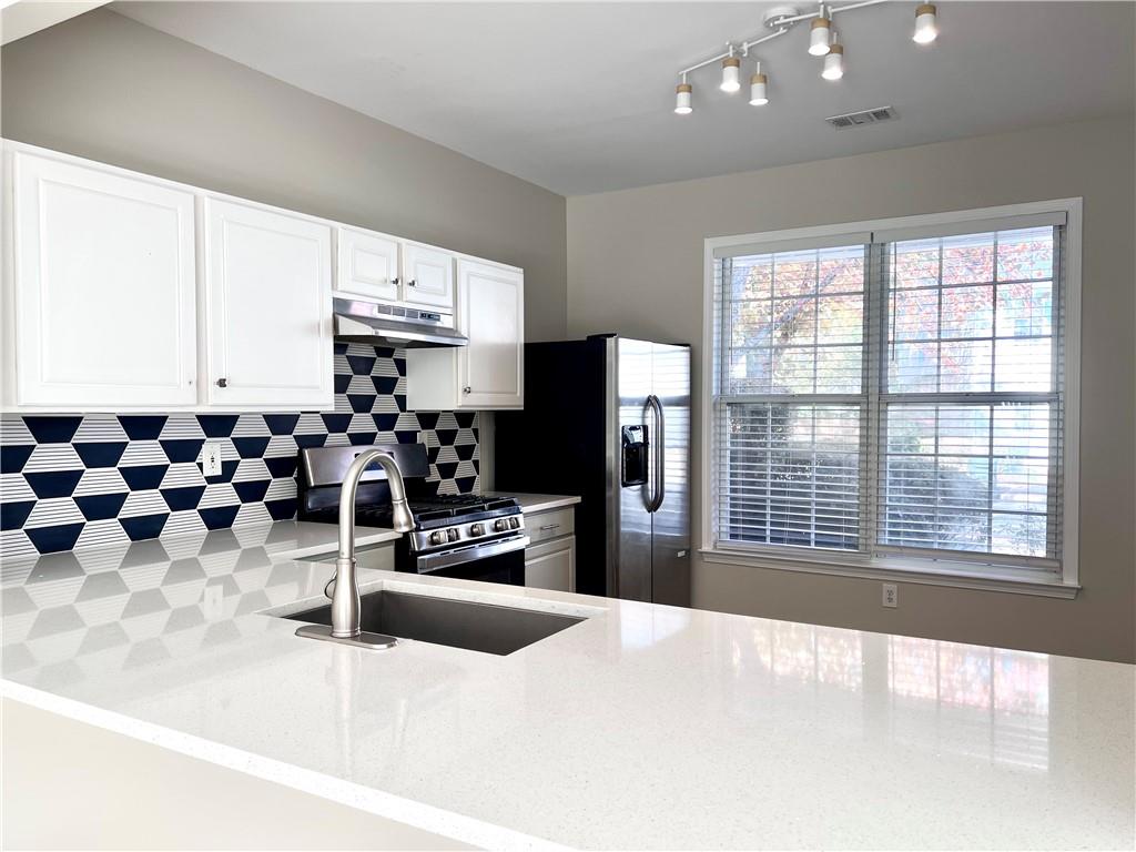 5770 Reps Trace Norcross, GA 30071 - Photo 4 of 9 a large room with lots of appliances and windows