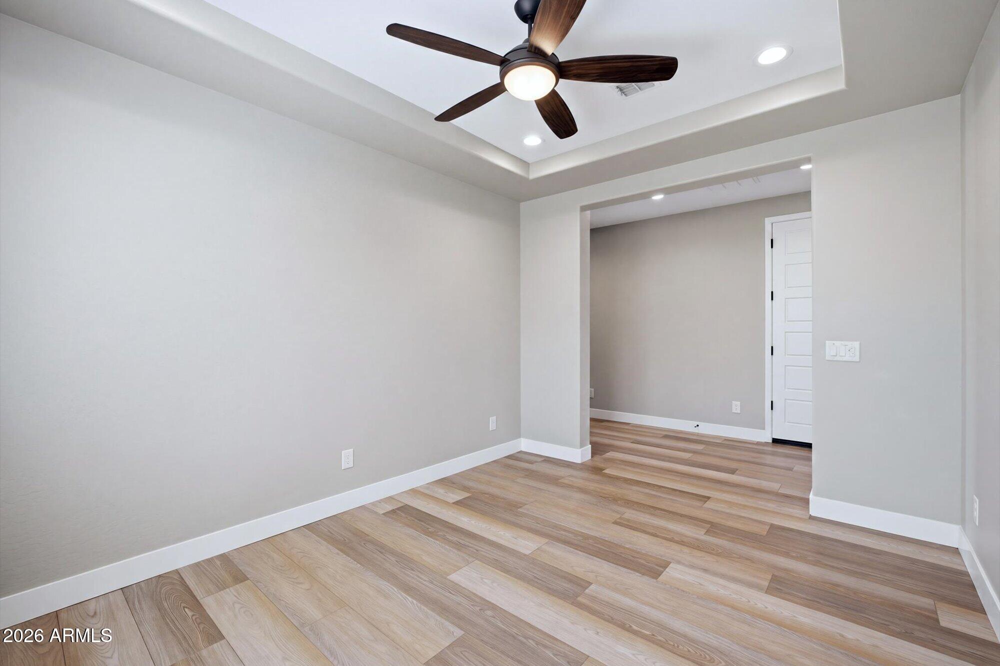 16849 West Merrell Street Goodyear, AZ 85395 - Photo 28 of 35 wooden floor in an empty room