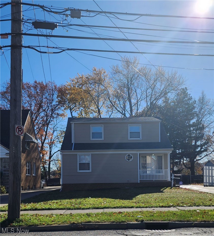 11620 Granger Road Cleveland, OH 44125 - Photo 1 of 14 View of front facade featuring a front lawn and covered porch