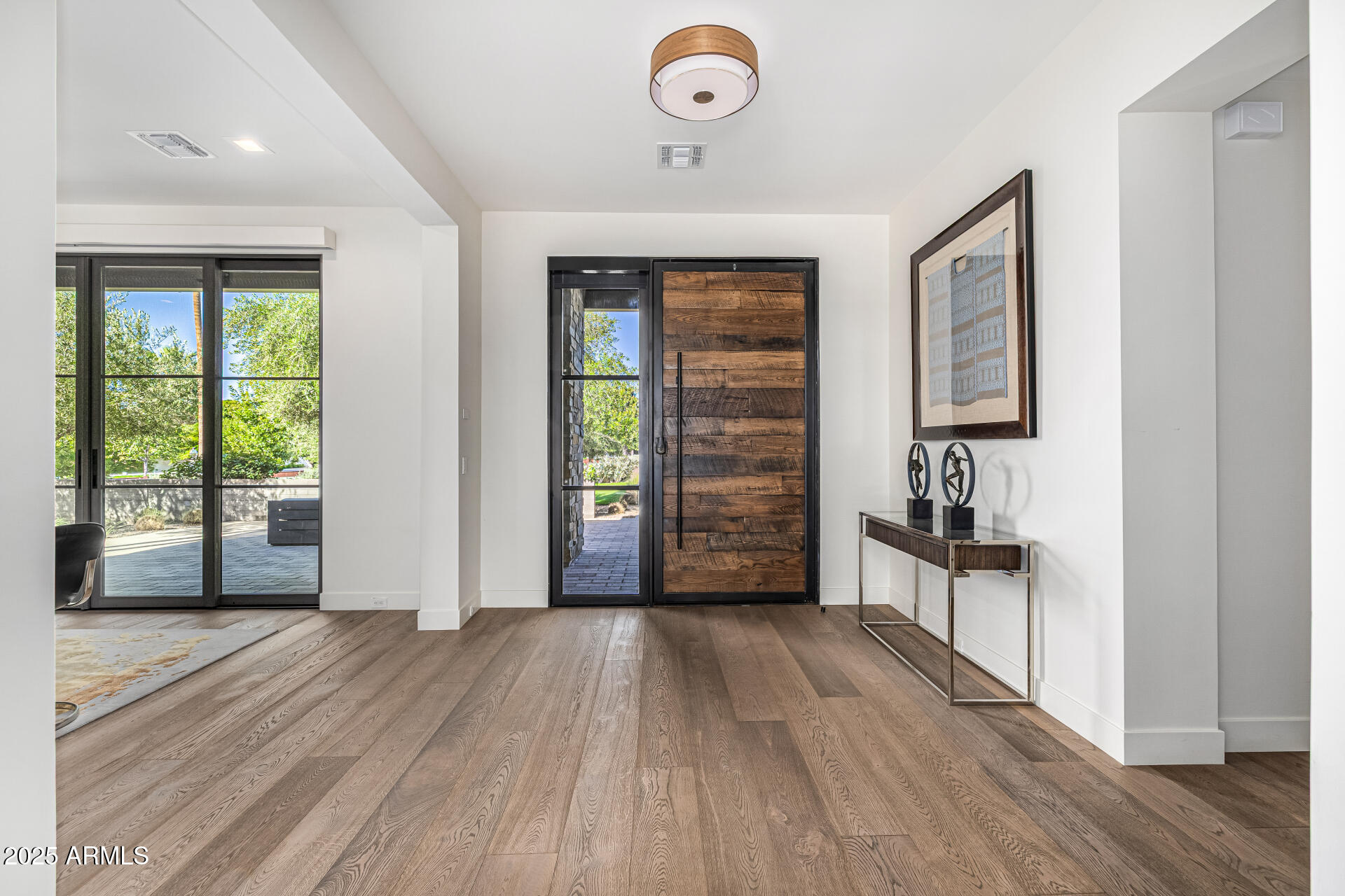 4535 North 49th Place Phoenix, AZ 85018 - Photo 14 of 75 wooden floor in an empty room with a window