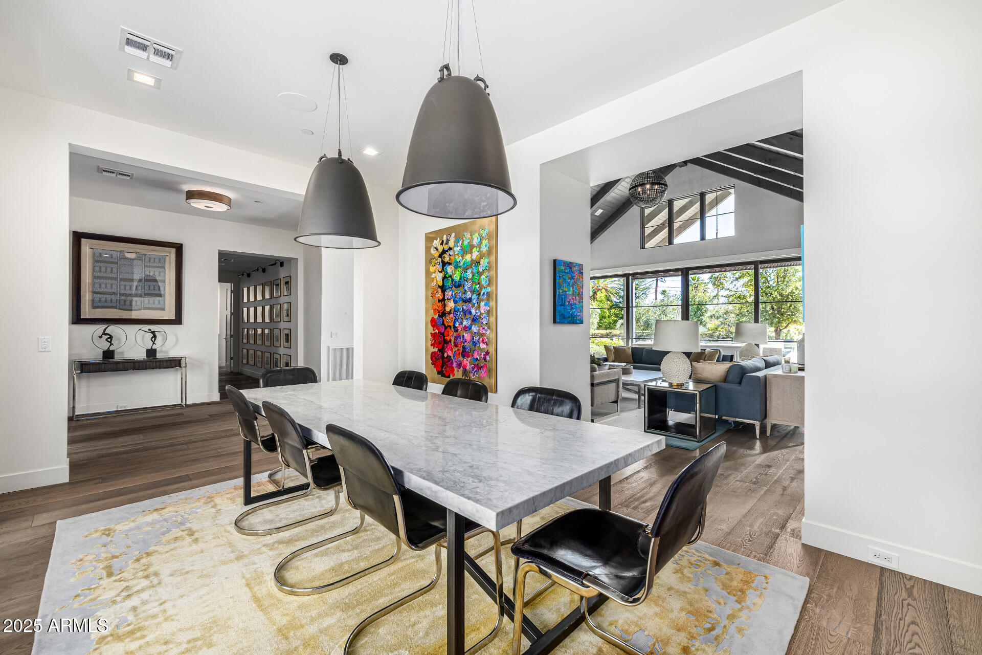 4535 North 49th Place Phoenix, AZ 85018 - Photo 17 of 75 a view of a dining room with furniture window and wooden floor