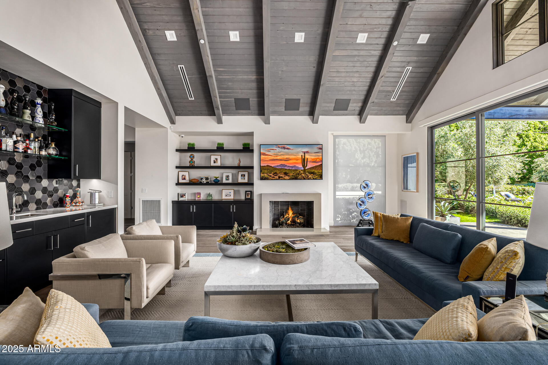 4535 North 49th Place Phoenix, AZ 85018 - Photo 20 of 75 a living room with furniture large window and a fireplace