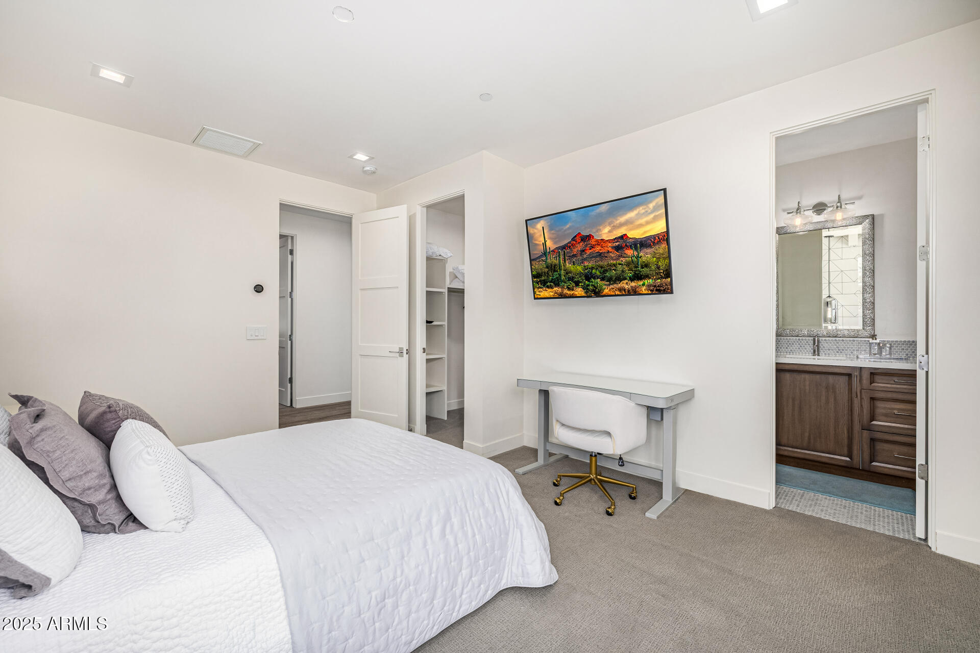 4535 North 49th Place Phoenix, AZ 85018 - Photo 42 of 75 a bedroom with a bed and a chair