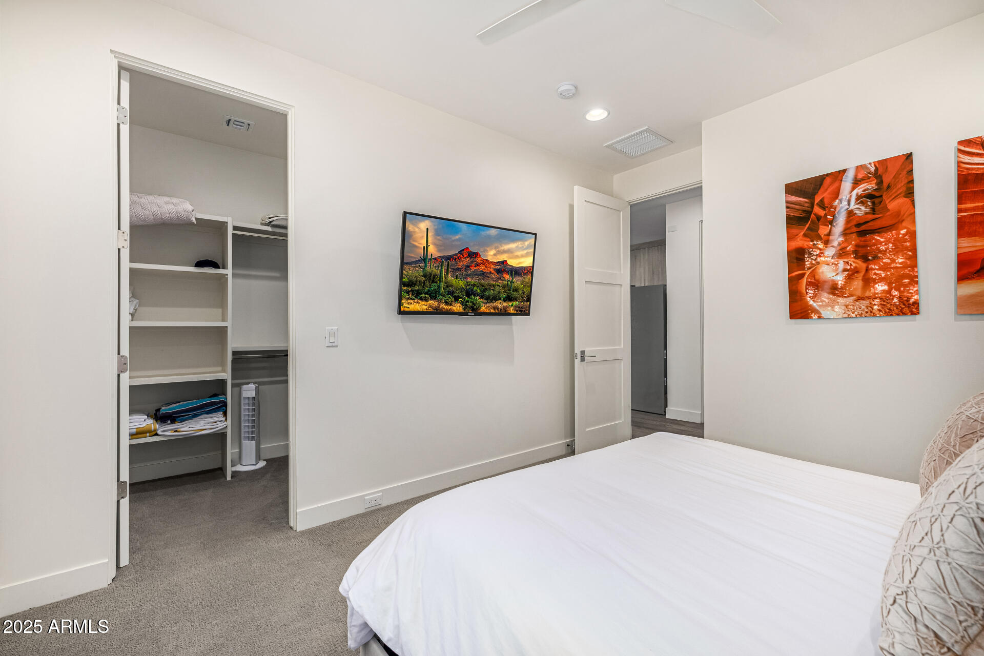 4535 North 49th Place Phoenix, AZ 85018 - Photo 57 of 75 a bedroom with a bed and a view of kitchen