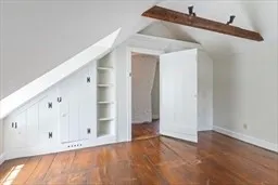 a view of room with wooden floor