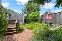 a front view of a house with a yard and a garage